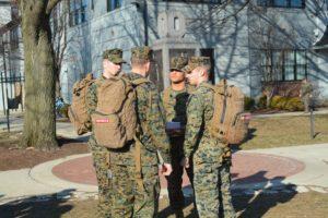 ROTC cadets grouped in discussion on the Ohio State oval.